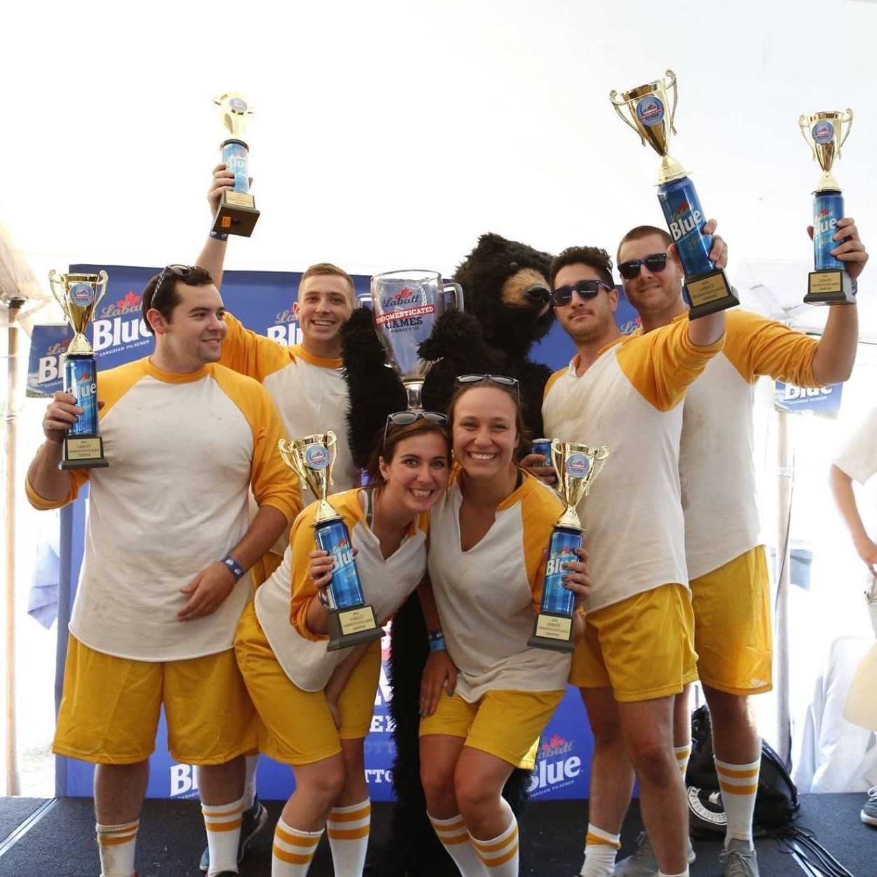 Picture of a team holding Labatt Blue trophies